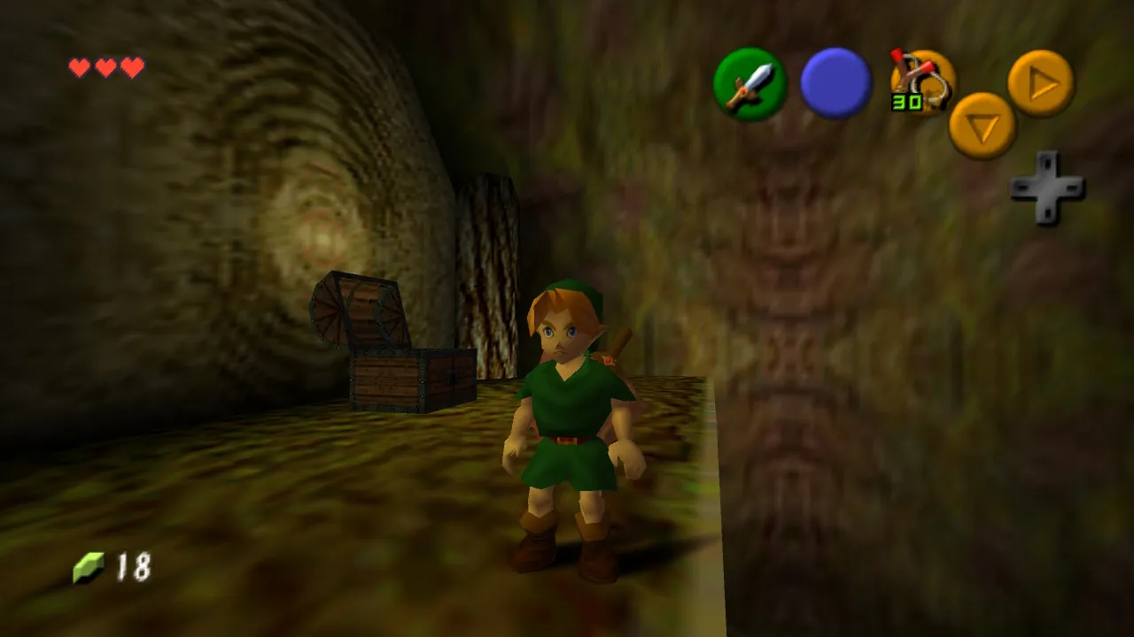 Link inside the Deku Tree, in front of an opened treasure chest. Standard-definition textures.