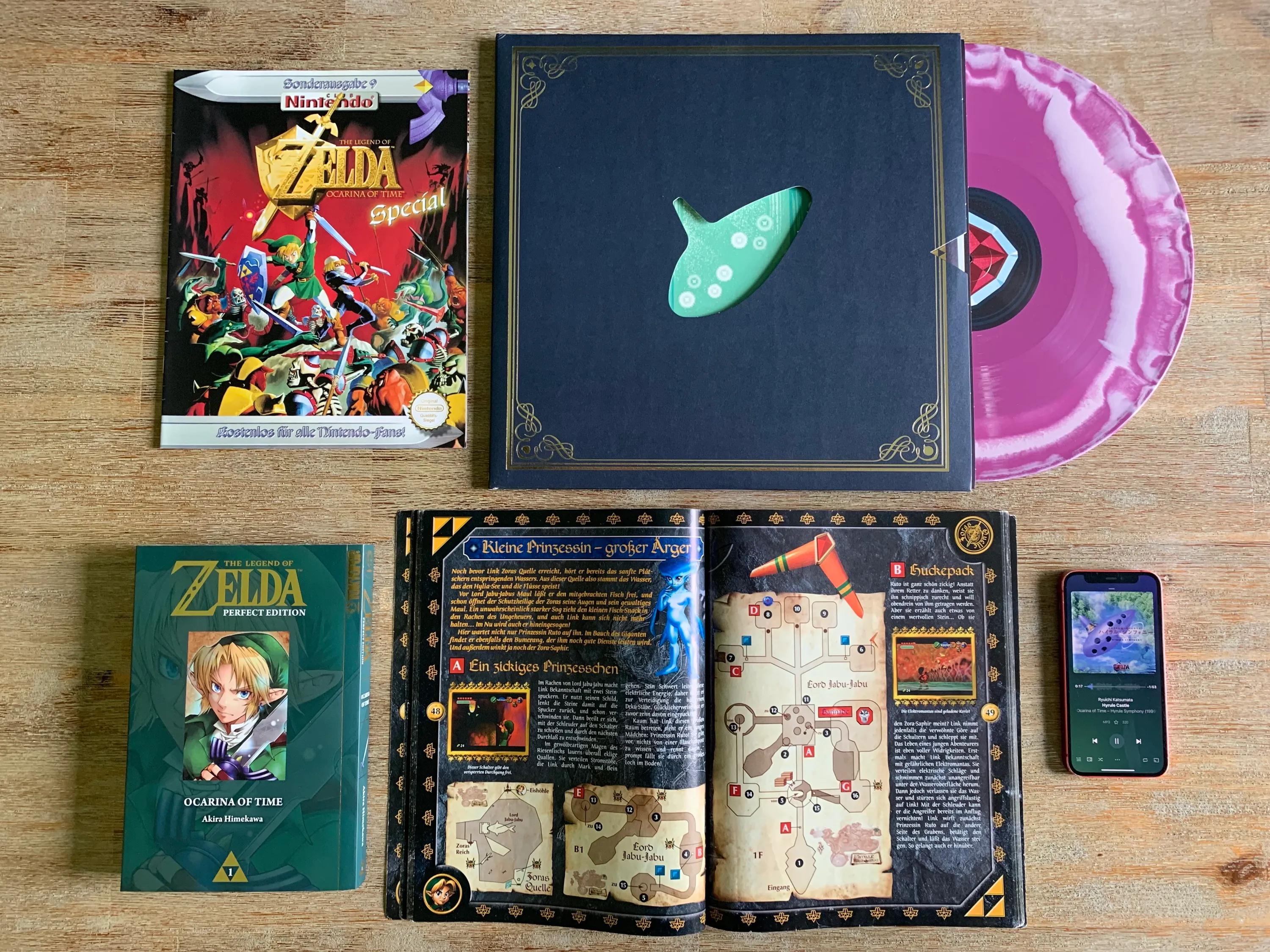 Secondary literature and music of Ocarina of Time layed out on my kitchen table. I am writing more about the individual items in the following text.