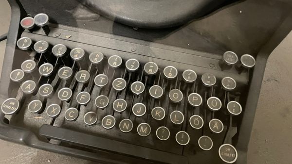 Close-up of a typewriter keyboard with a shortcut key for the SS rune.